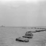 WW2 Barrier with guardship - Photo from Imperial War Museum via wikipedia