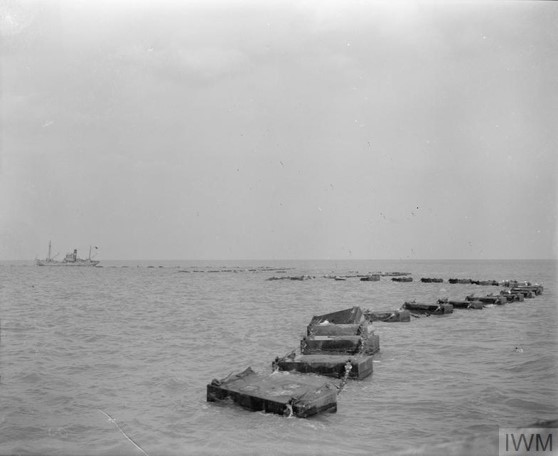 WW2 Barrier with guardship - Photo from  Imperial War Museum via wikipedia